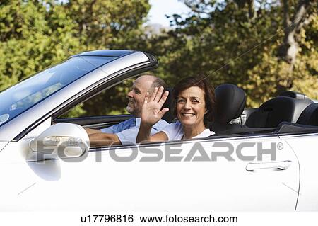 A senior couple driving a car View Large Photo Image Stock Photograph - A senior couple driving a car. Fotosearch