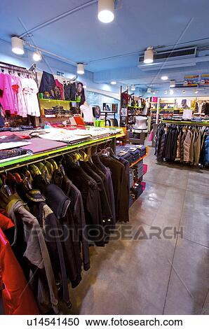 Different kinds of clothes showing on the shelf in the store, Clothing Store View Large Photo Image Stock Image - Different kinds of clothes showing on the shelf in the store, Clothing Store. Fotosearch