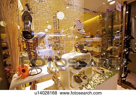 Different kinds of shoes showing on the shelf in the store, Shoe Store View Large Photo Image Stock Photo - Different kinds of shoes showing on the shelf in the store, Shoe Store. Fotosearch