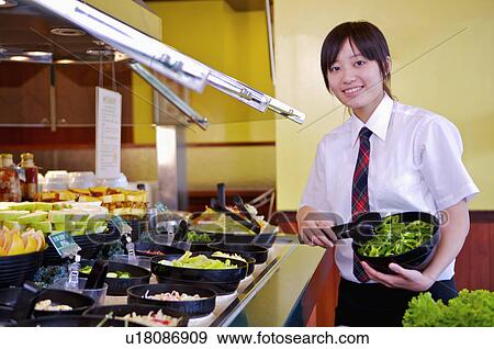 Young waitress preparing for the food in the restaurant, Restaurant View Large Photo Image Stock Photo - Young waitress preparing for the food in the restaurant, Restaurant. Fotosearch