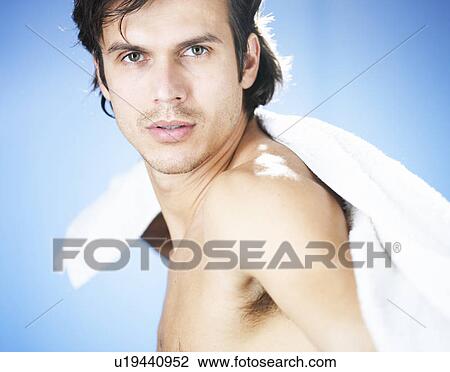 A young man using a towel View Large Photo Image Stock Image - A young man using a towel. Fotosearch