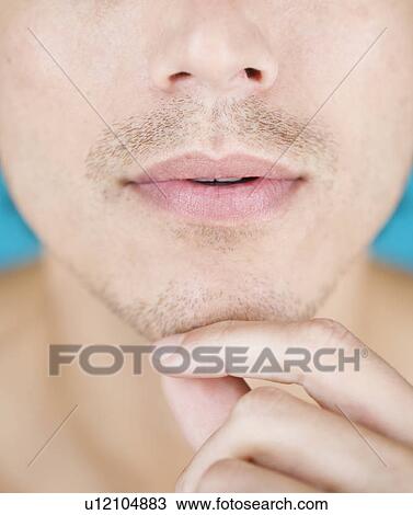 Portrait of a young man View Large Photo Image Stock Image - Portrait of a young man. Fotosearch