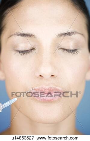 A young woman having a collagen injection View Large Photo Image Stock Photo - A young woman having a collagen injection. Fotosearch