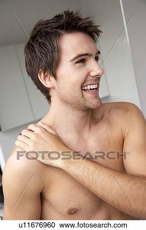 Young man in the bathroom View Large Photo Image Stock Image - Young man in the bathroom. Fotosearch