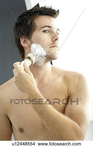 Young man shaving View Large Photo Image Picture - Young man shaving. Fotosearch