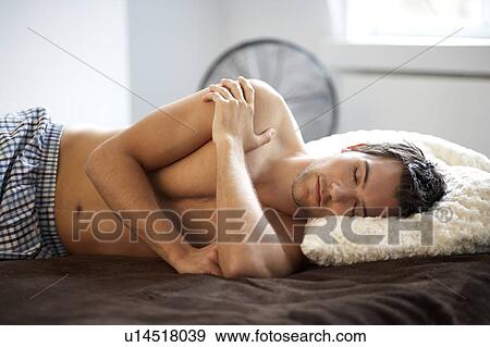 Young man sleeping View Large Photo Image Stock Photo - Young man sleeping. Fotosearch