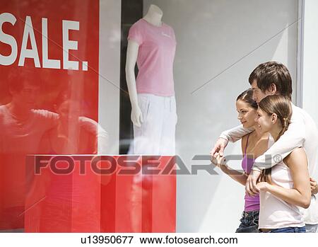 Stock Photo - A group of friends out shopping. Fotosearch