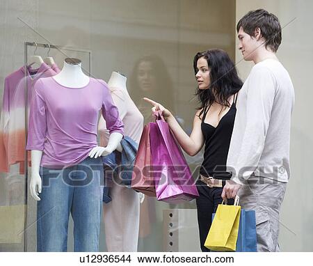 A young couple out shopping View Large Photo Image Picture - A young couple out shopping. Fotosearch