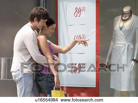 Picture - A young couple out shopping. Fotosearch