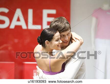 Stock Image - A young couple out shopping. Fotosearch