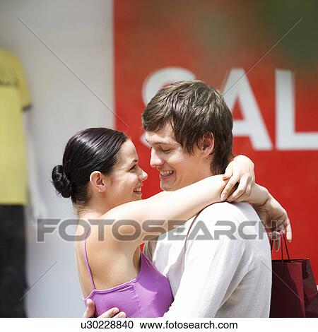 A young couple out shopping View Large Photo Image Stock Image - A young couple out shopping. Fotosearch