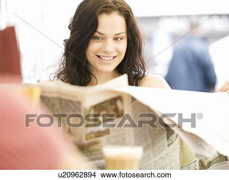 A young woman having a break from shopping View Large Photo Image Picture - A young woman having a break from shopping. Fotosearch