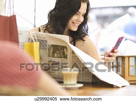 A young woman having a break from shopping View Large Photo Image Stock Photography - A young woman having a break from shopping. Fotosearch