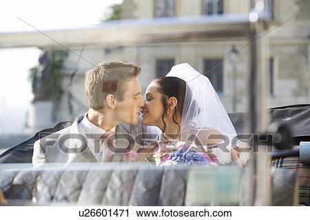 A bride and groom sitting in the wedding car View Large Photo Image Stock Image - A bride and groom sitting in the wedding car. Fotosearch