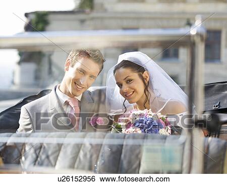 A bride and groom sitting in the wedding car View Large Photo Image Stock Photograph - A bride and groom sitting in the wedding car. Fotosearch