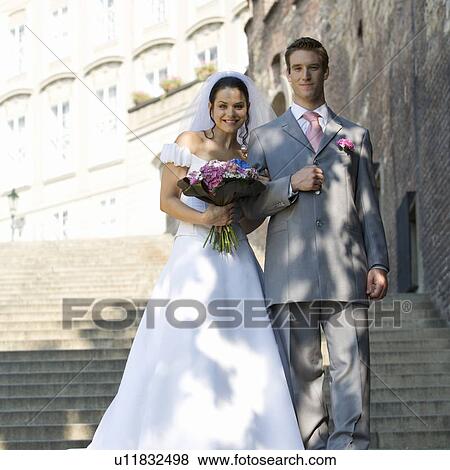 A bride and groom walking down steps View Large Photo Image Stock Photo - A bride and groom walking down steps. Fotosearch
