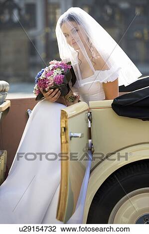 Stock Image - A bride arriving for her wedding. Fotosearch
