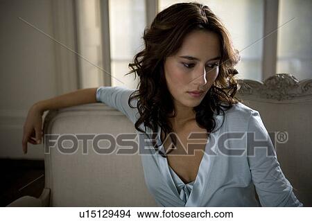 Picture - A young woman wearing silk pyjamas. Fotosearch
