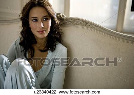 A young woman wearing silk pyjamas View Large Photo Image Stock Image - A young woman wearing silk pyjamas. Fotosearch