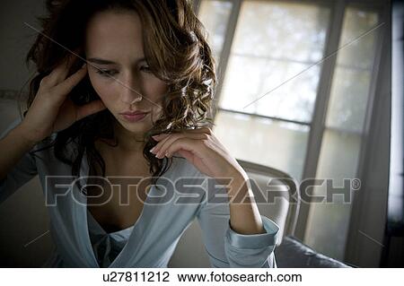 A young woman wearing silk pyjamas View Large Photo Image Stock Image - A young woman wearing silk pyjamas. Fotosearch