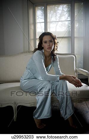 A young woman wearing silk pyjamas View Large Photo Image Stock Image - A young woman wearing silk pyjamas. Fotosearch