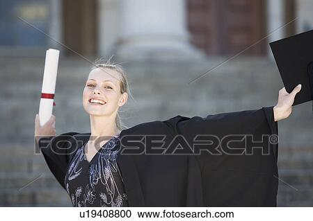 Stock Image - A graduate celebrating. Fotosearch