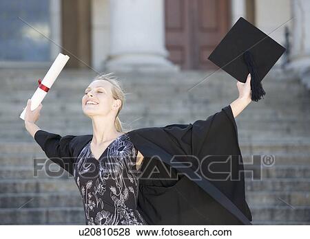 Stock Photo - A graduate celebrating. Fotosearch