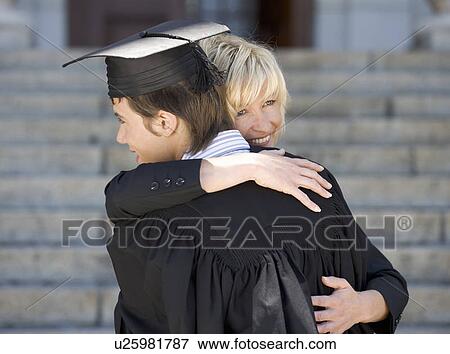 A graduate hugging his mother View Large Photo Image Stock Photo - A graduate hugging his mother. Fotosearch
