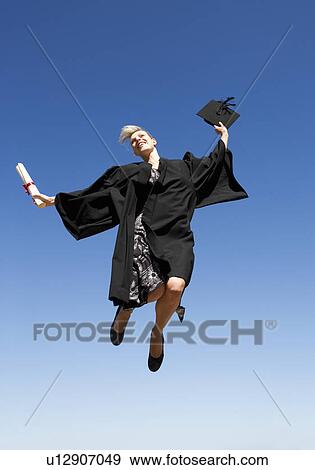 A graduate jumping for joy View Large Photo Image Stock Photo - A graduate jumping for joy. Fotosearch
