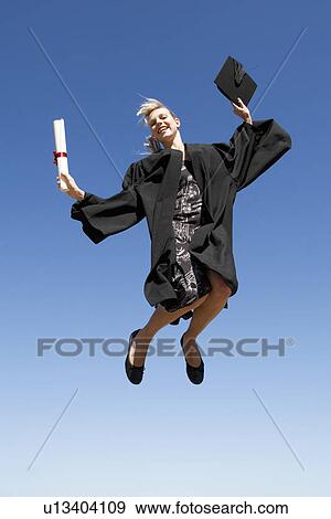 A graduate jumping for joy View Large Photo Image Stock Photo - A graduate jumping for joy. Fotosearch