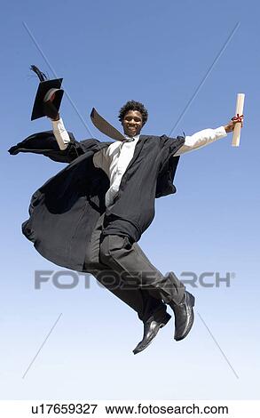 A graduate jumping for joy View Large Photo Image Stock Photo - A graduate jumping for joy. Fotosearch