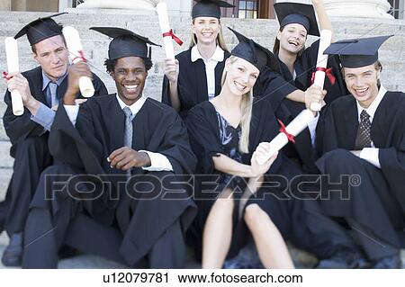 A group of graduates celebrating View Large Photo Image Stock Image - A group of graduates celebrating. Fotosearch