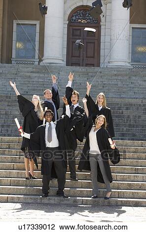 A group of graduates celebrating View Large Photo Image Stock Image - A group of graduates celebrating. Fotosearch