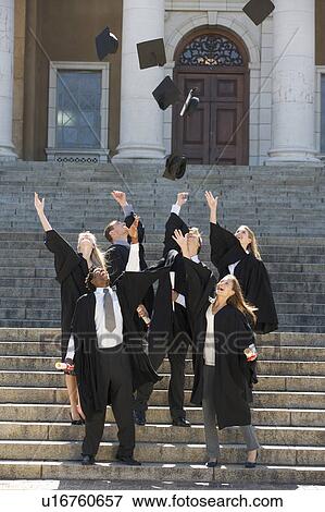 A group of graduates celebrating View Large Photo Image Stock Photo - A group of graduates celebrating. Fotosearch