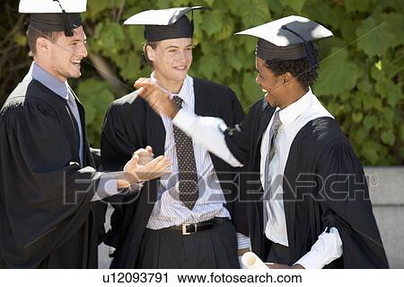 Three graduates celebrating View Large Photo Image Stock Image - Three graduates celebrating. Fotosearch