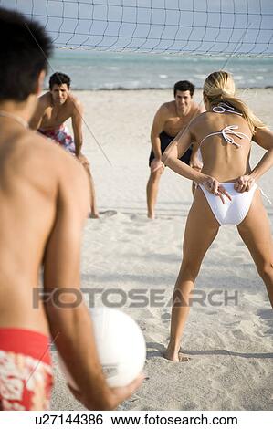 A game of beach volleyball View Large Photo Image Stock Photograph - A game of beach volleyball. Fotosearch