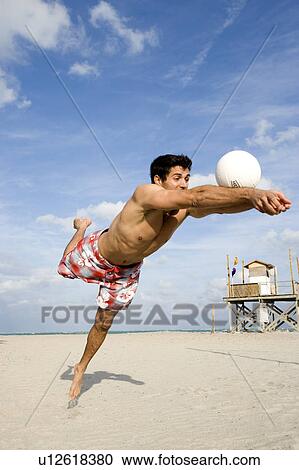 Stock Image - A man diving for the ball. Fotosearch
