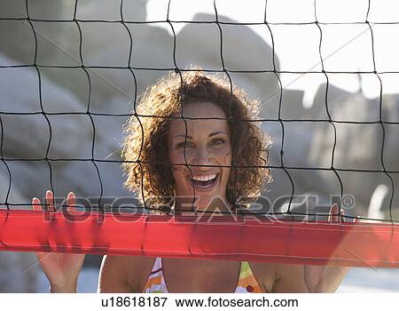 A woman playing beach volleyball View Large Photo Image Stock Photo - A woman playing beach volleyball. Fotosearch