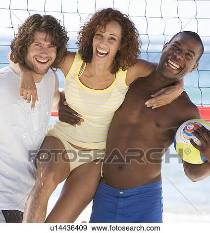 Three friends on a beach View Large Photo Image Stock Photo - Three friends on a beach. Fotosearch