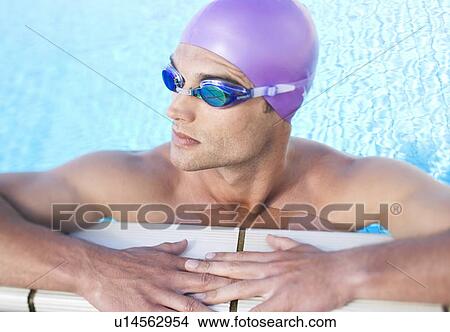 A young man in a swimming pool View Large Photo Image Picture - A young man in a swimming pool. Fotosearch