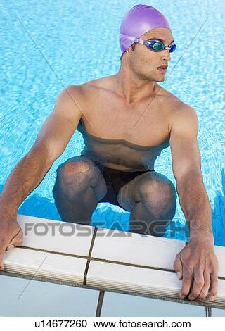 A young man in a swimming pool View Large Photo Image Stock Image - A young man in a swimming pool. Fotosearch