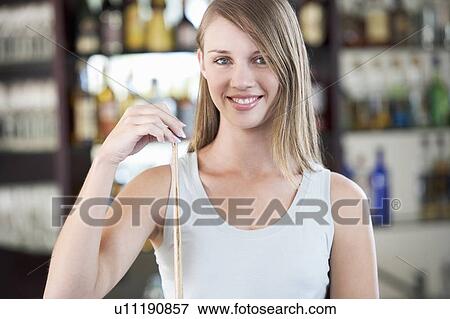 Stock Photo - A teenage girl playing pool. Fotosearch