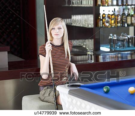 A teenage girl playing pool View Large Photo Image Stock Photo - A teenage girl playing pool. Fotosearch
