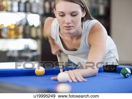 A teenage girl playing pool View Large Photo Image Stock Photo - A teenage girl playing pool. Fotosearch