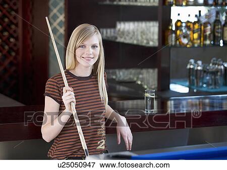 A teenage girl playing pool View Large Photo Image Stock Photo - A teenage girl playing pool. Fotosearch
