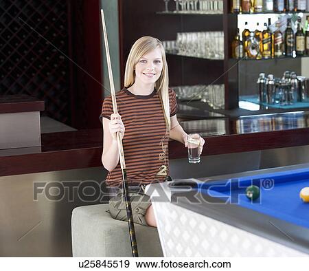A teenage girl playing pool View Large Photo Image Stock Photo - A teenage girl playing pool. Fotosearch