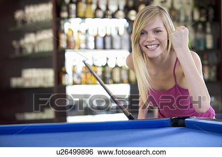 A teenage girl playing pool View Large Photo Image Stock Photograph - A teenage girl playing pool. Fotosearch