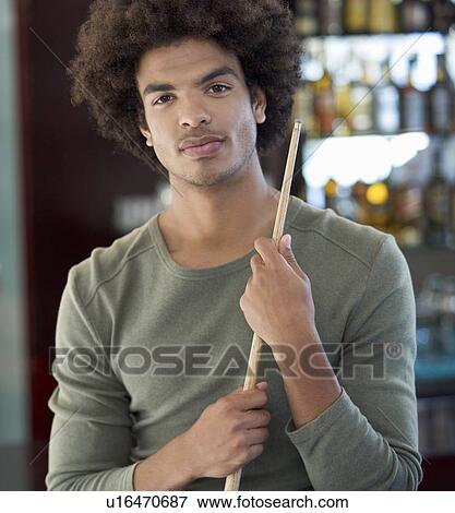 A young man playing pool View Large Photo Image Stock Photo - A young man playing pool. Fotosearch