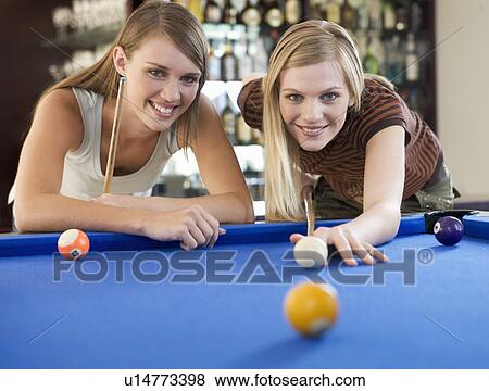 Two teenage girls playing pool View Large Photo Image Stock Photo - Two teenage girls playing pool. Fotosearch