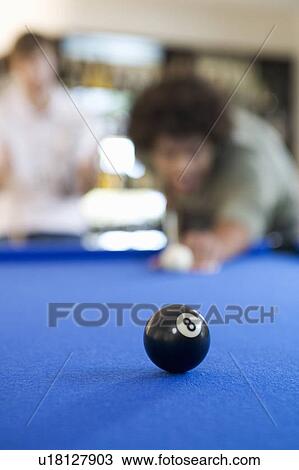 Two young men playing pool View Large Photo Image Stock Image - Two young men playing pool. Fotosearch